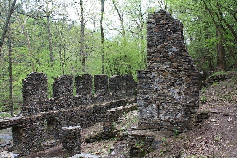 Stone walls stand along the forested shore of the Chattahoochee River at Chattahoochee NRA.