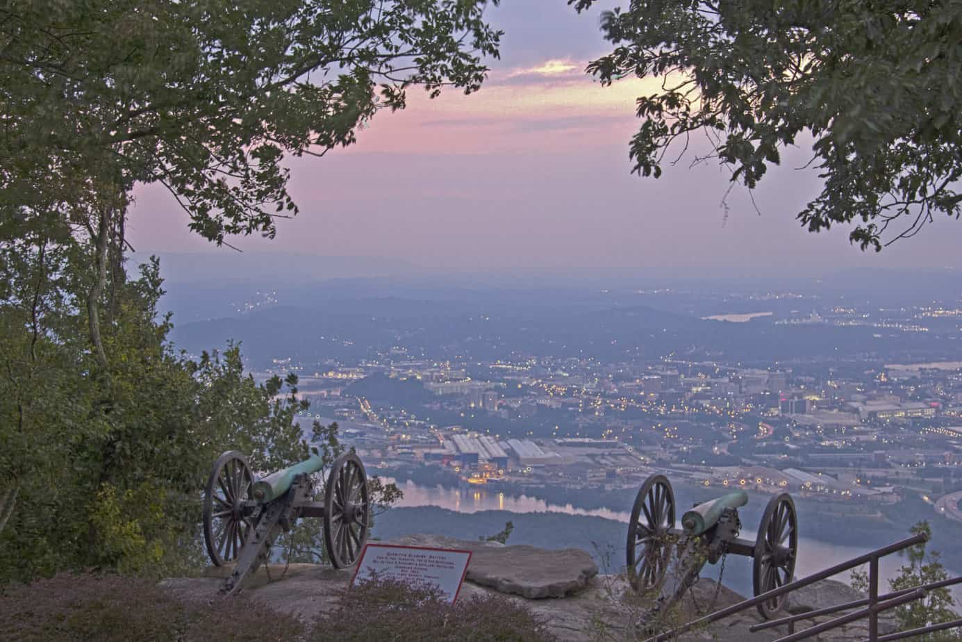 Two Civil War canon keep watch over modern Chattanooga and a beautiful Southern sunset. Chickamauga and Chattanooga National Military Park is one of the 12 Best National Parks in Georgia.