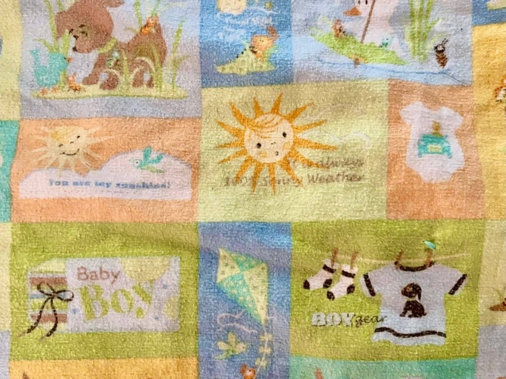 Close-up of a baby blanket. Miscarriage gift box.