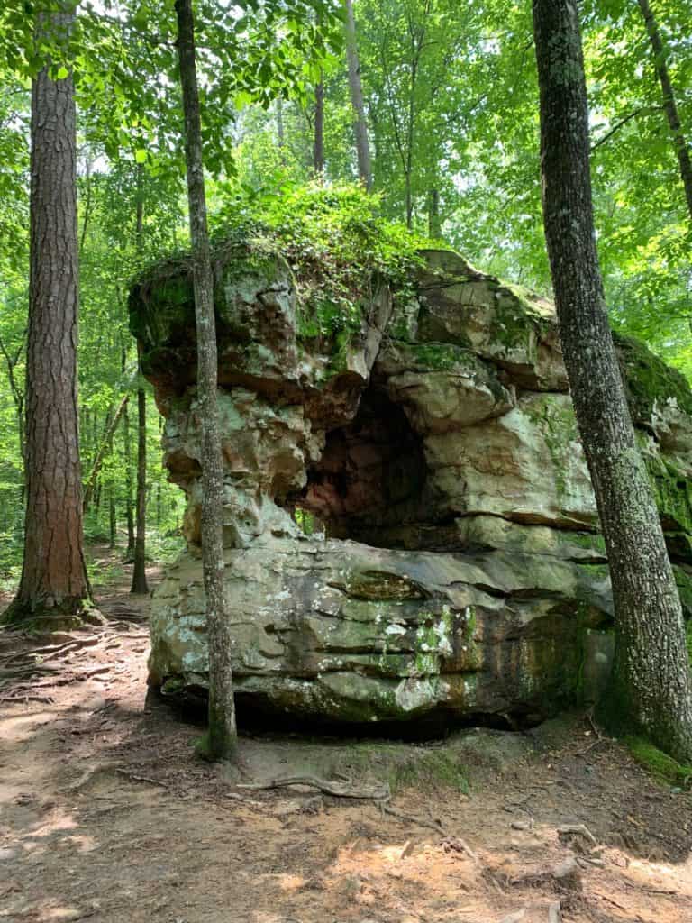 A natural arch forms in one of Moss Rock's enormous boulders. Moss Rock's Boulder Field is one of the 17 best hiking trails in Birmingham AL.