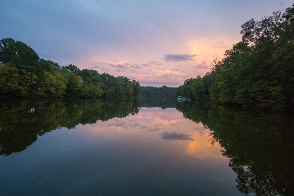 Placid waters reflect the evening sky at a beautiful lake in Southern Illinois.