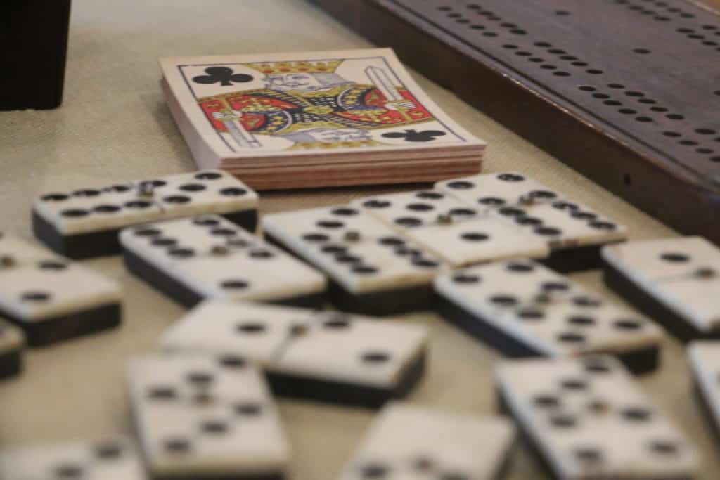 Playing cards and dominoes and other artifacts sit in a display at the National Historic Oregon Trail Interpretive Center.