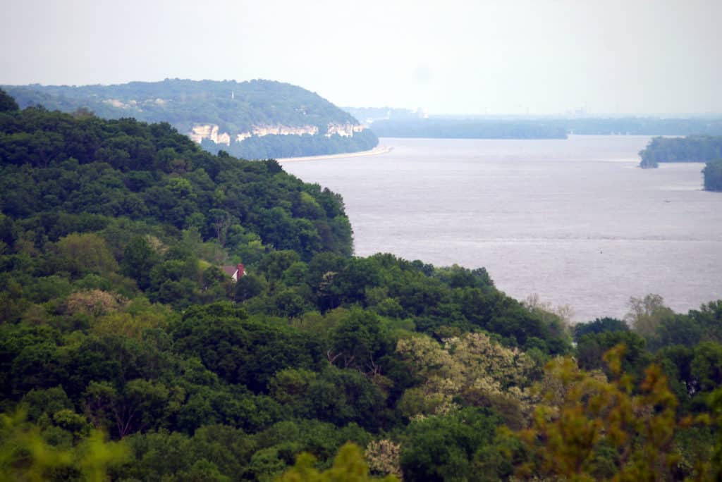 Forested bluff stand over the Mississippi River in Southern Illinois.