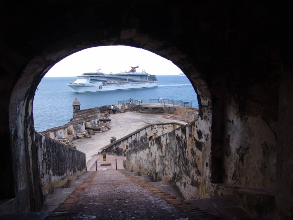 A castle tunnel fames a cruise ship at the historic San Juan fort of San Juan National Historic Site. Image by NPS. list of national parks and monuments by state