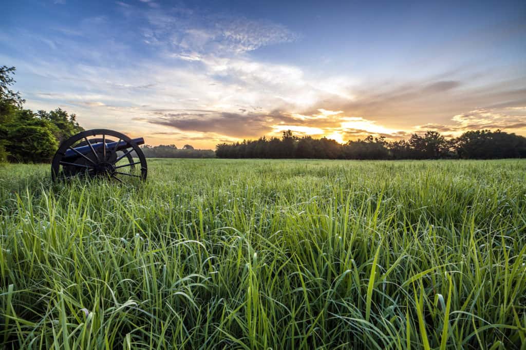 A civil war canon stands on an early morning at Stones River National Battlefield. Image by NPS. list of national parks and monuments by state