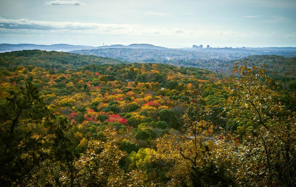 Autumn colors brighten a Connecticut forest, a city stands on the horizon. Image from GPA Photo Archive. list of national parks and monuments by state