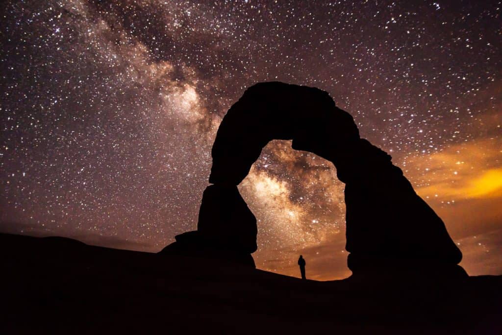 Delicate Arch stands amid starry splendor on a night at Arches National Park. You can find all of Utah's national parks on Dinkum Tribe's list of national parks and monuments by state. Image by NPS.