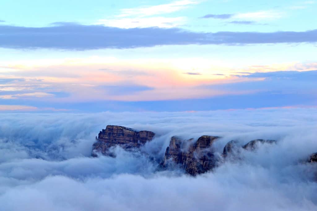 Clouds veil nearly all of Grand Canyon National Park. You can see all of Arizona's National Parks on Dinkum Tribes' List of National Parks and Monuments by State. Image by NPS / Maci MacPherson.