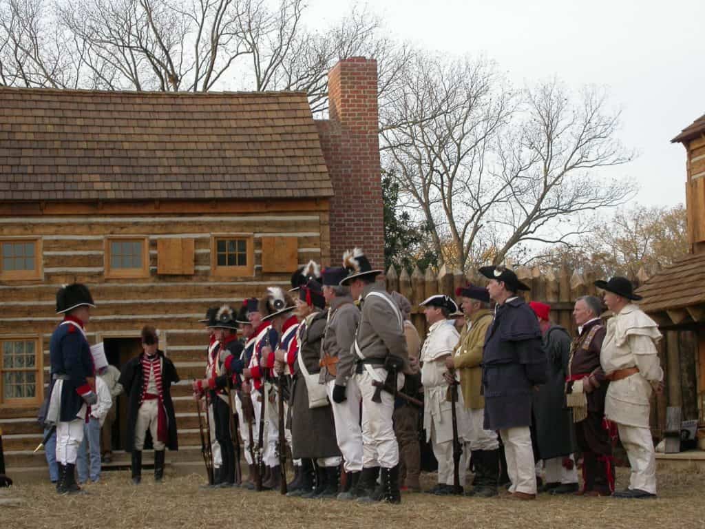 Dressed reenactors stand for inspection at Fort Massac State Park. Fort Massac State Park is one of the 37 best things to do in Southern Illinois.