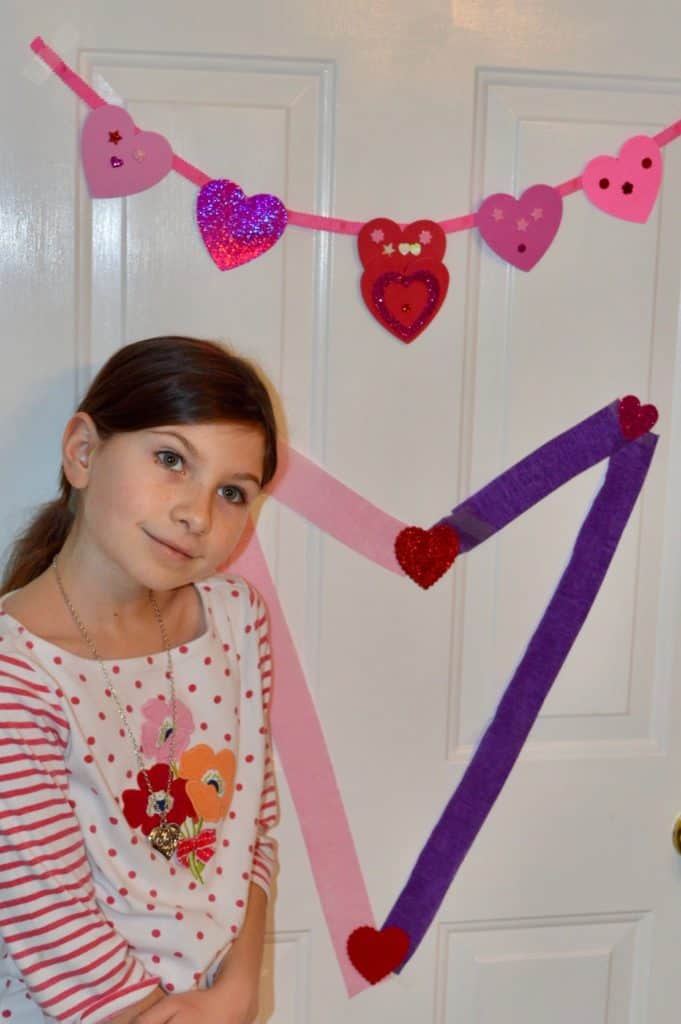 Valentine's decor on a door made by child. Valentine's Day picnic ideas.