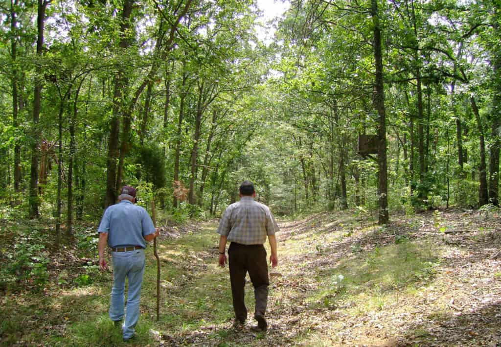 Two men walk along the wagon swales of the historic Trail of Tears. Trail of Tears National Historic Trail is one of the 37 best things to do in Southern Illinois.