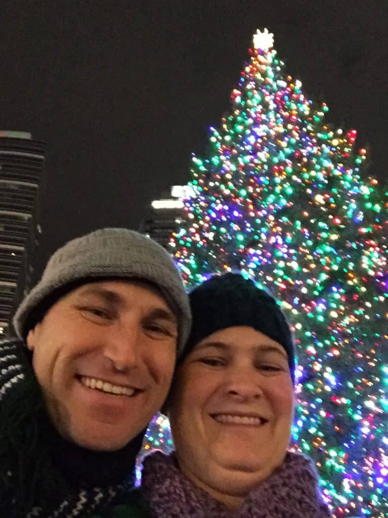 My wife and I smile for a selfie next to Portland's biggest Christmas tree.