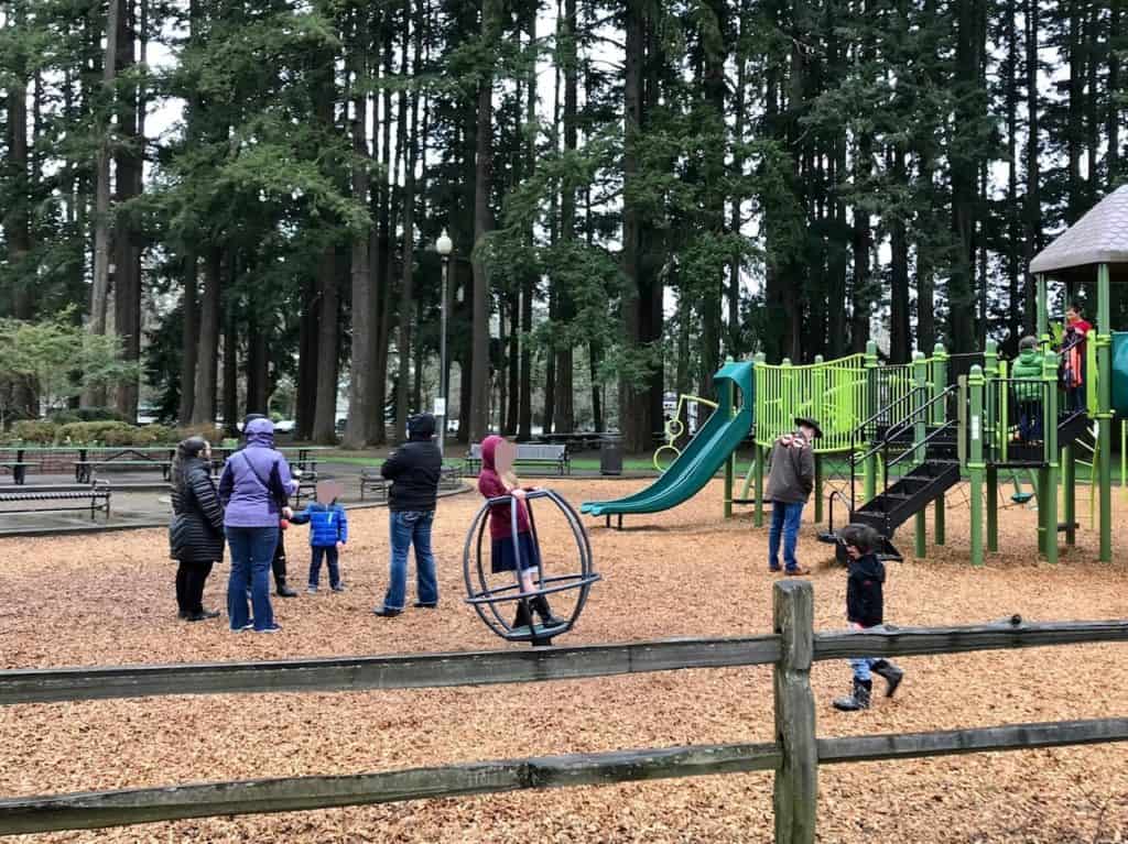 Playground with shade and picnic tables behind. Great spot for a Valentine's Day picnic.