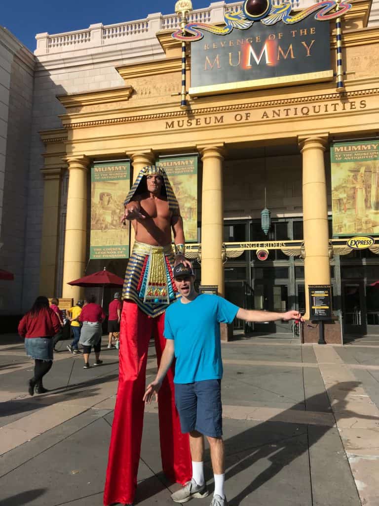Man in front of the Mummy Ride with Imhotep guy at Universal Studios Orlando.