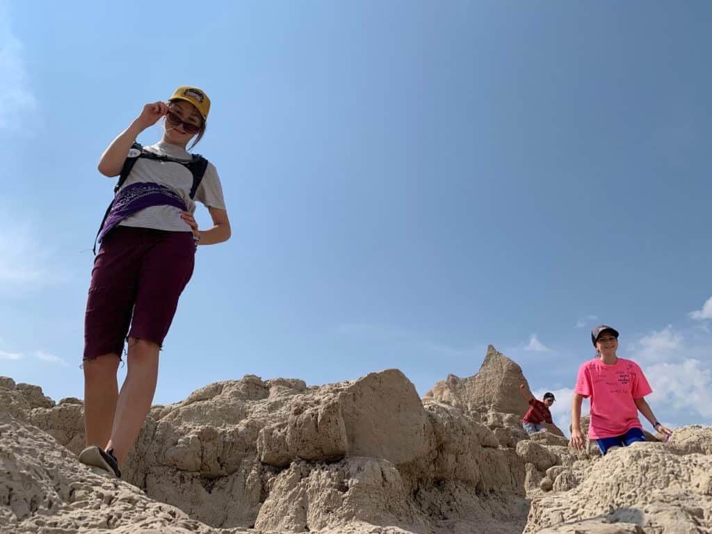 Our children explore around the rock formations of Badlands National Park in South Dakota. list of national parks and monuments by state