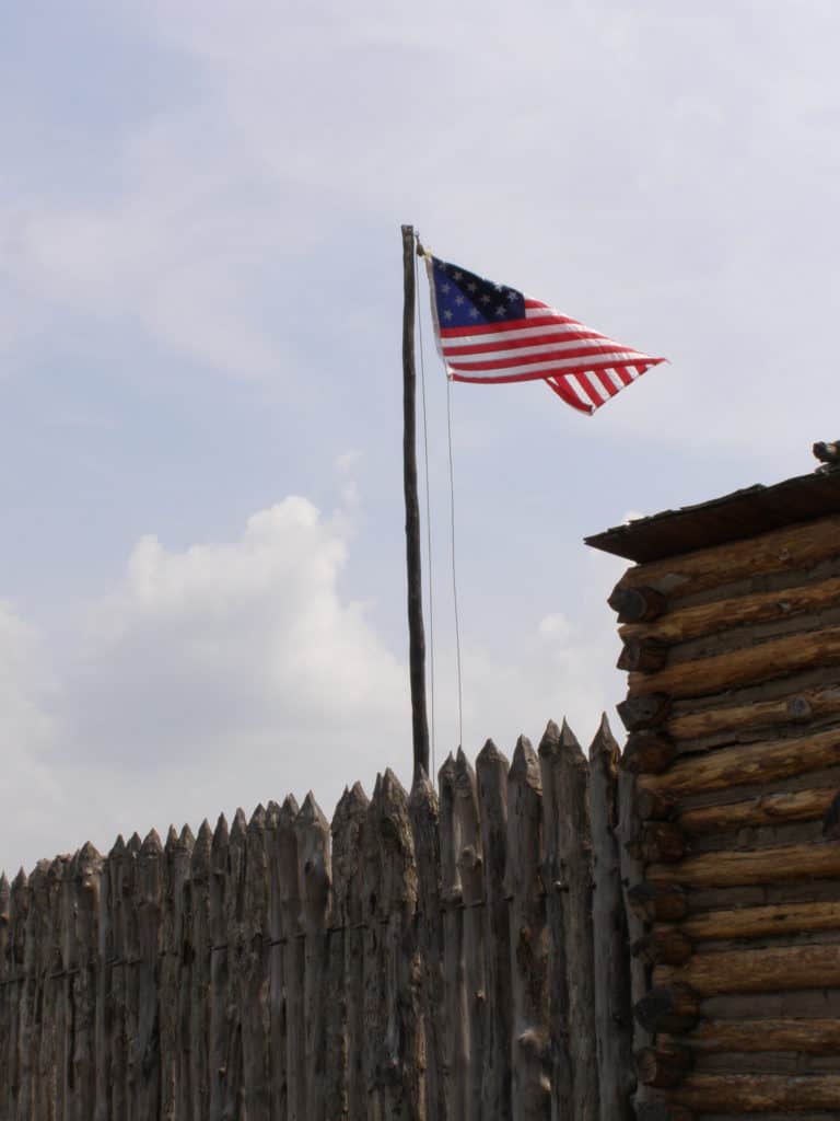 An early American flag waves over Camp Dubois in Southwest Illinois. Historic Camp Dubois is one of 37 best things to do in Southern Illinois.