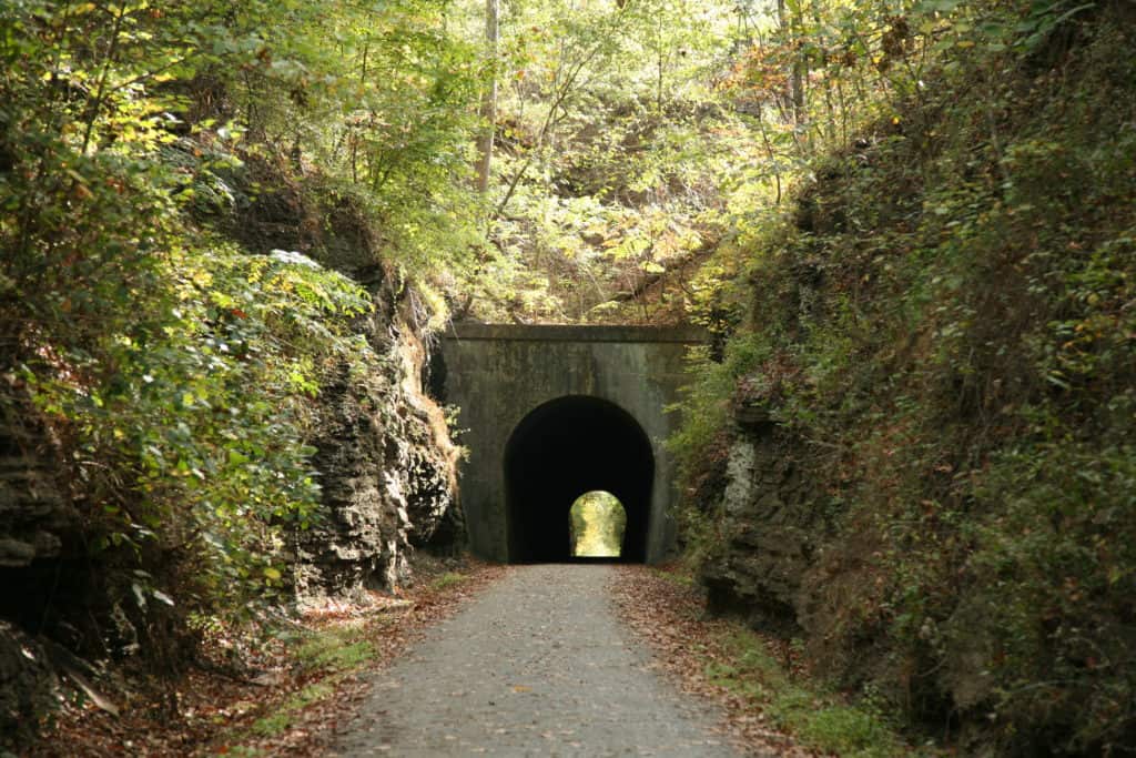 A railway tunnel cuts through the Shawnee Hills on the Tunnel Hill State Trail. The Tunnel Hill State Trail is one of the 37 best things to do in Southern Illinois. 
