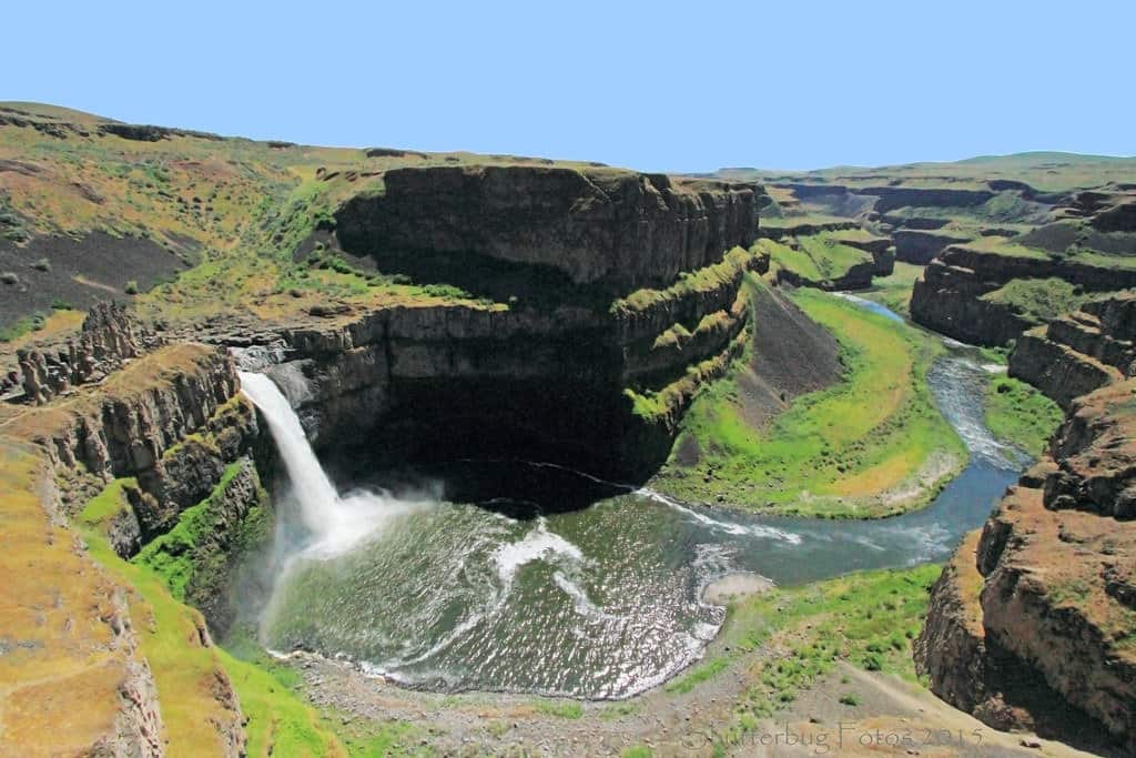 A waterfall cascades off a basalt cliff in the scablands created by the Missoula Mega-floods.