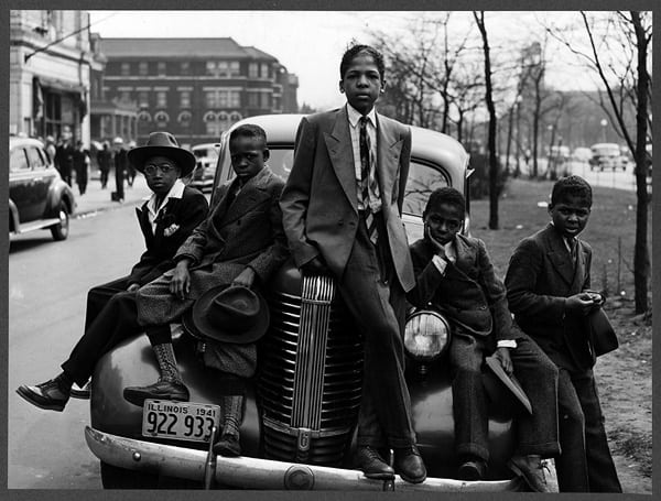 Five African American boys sit on the front of a car in a historic, black and white photo. African American Museum is one of the 37 best things to do in Southern Illinois.