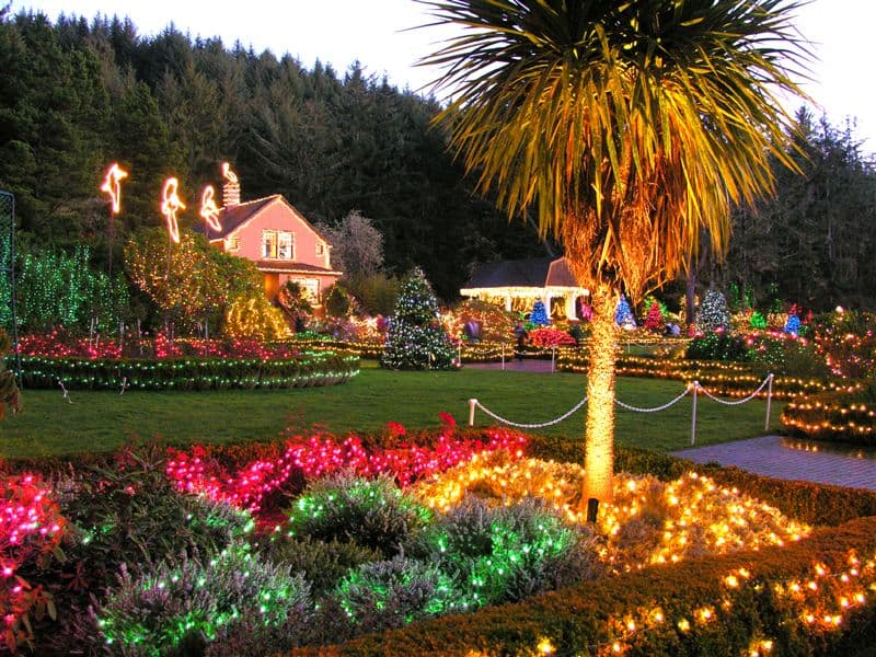 Christmas lights illuminate the historic mansion and gardens at Shore Acres State Park. The Oregon Coast has several Christmas displays that rival any Christmas lights in Salem Oregon.