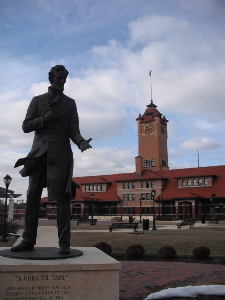 A bronze statue of Lincoln stands in front of Springfield's Union Station Train Museum.