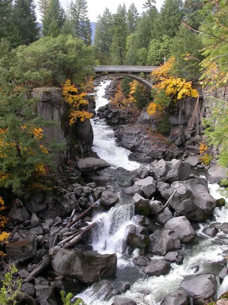 River waters cascade down mountain rapids on an autumn day Oregon's mountain valleys.