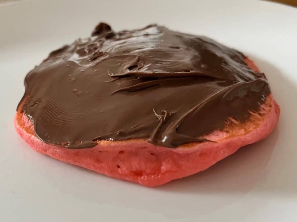 Pink pancake with Nutella. Valentine's breakfast Ideas Kids.