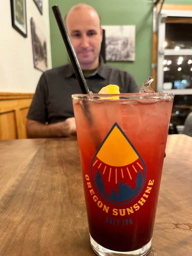 A glass that says "Oregon Sunshine" holds House Made Berry Lemonade. 