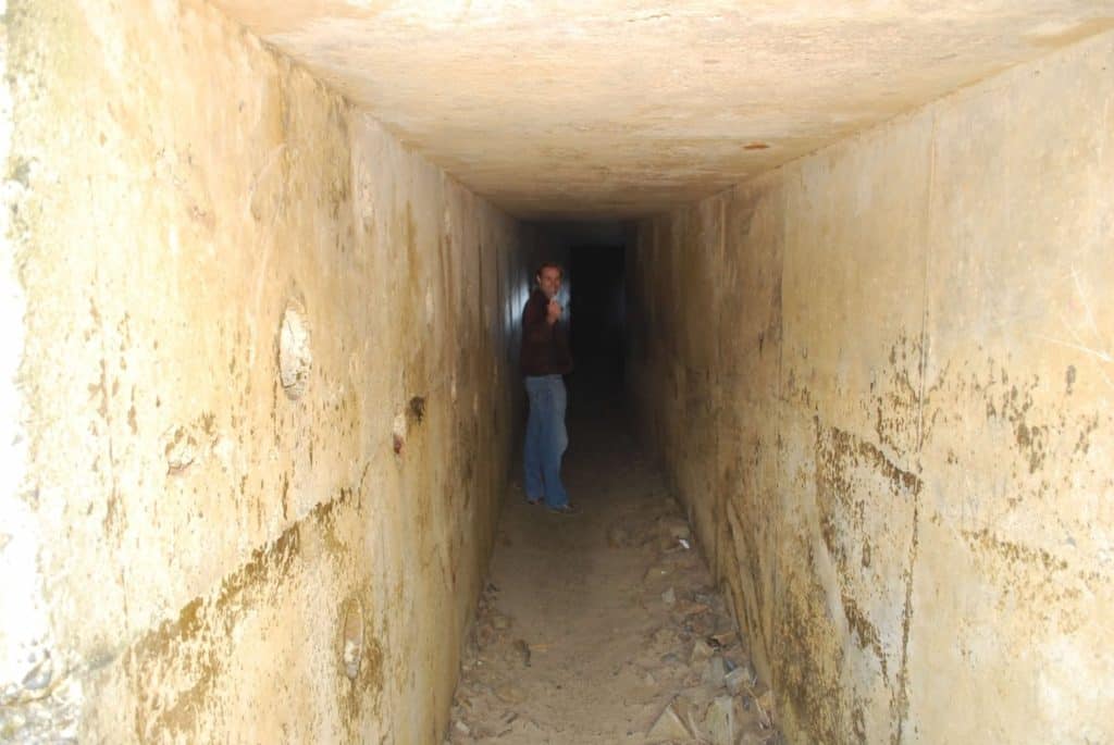 A younger me explores the tunnel at Tunnel Beach. Tunnel Beach is one of the best things to do on the Oregon Coast with kids.