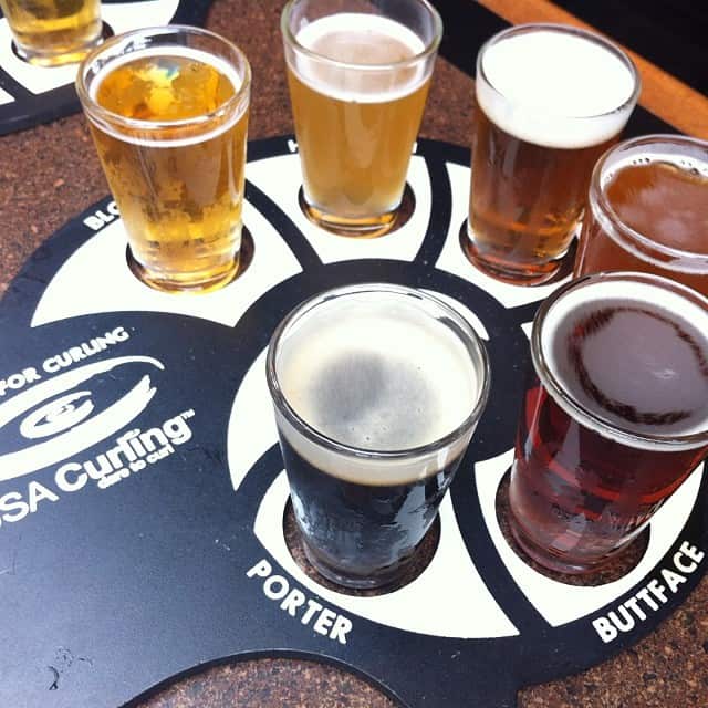 A flight of beers stand at RAM in Salem.