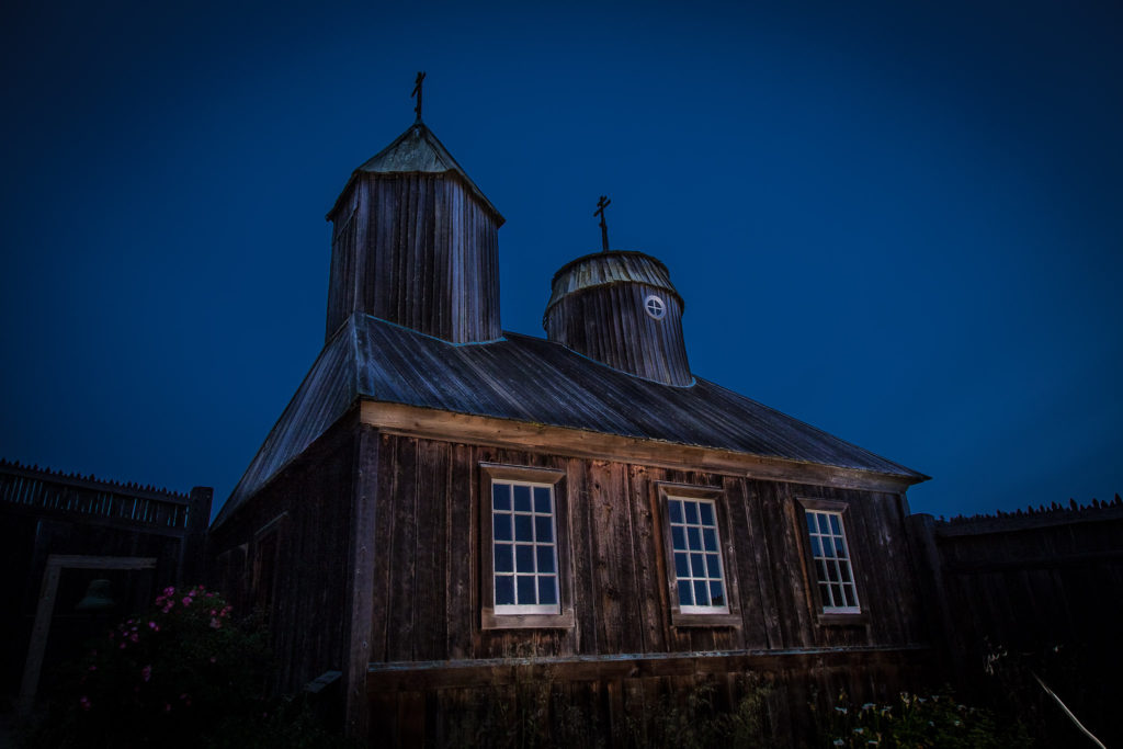 Fort Ross stands in the moonlight. Fort Ross is one of many wonders to explore if you know how to get to Redwood National Park.