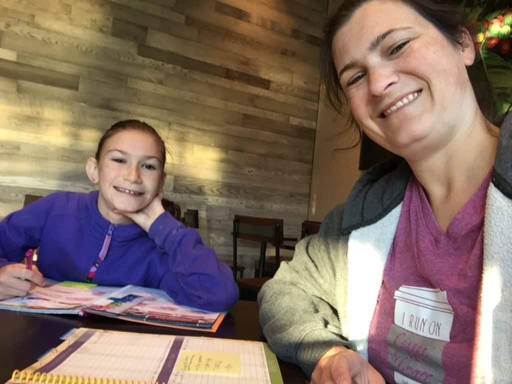 My wife and daughter smile in a photo of their weekly coffee planning dates. Life coaching is a key part of helping your ADHD child attain health and success.