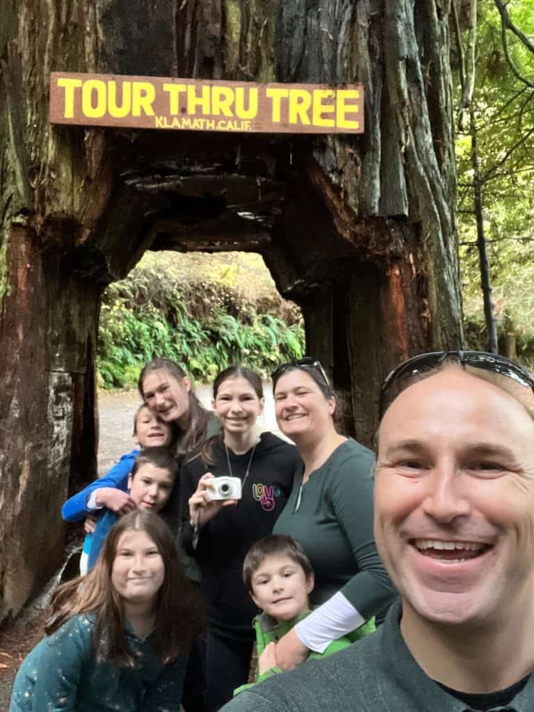 Family in front of the Tour Through Tree in Klamath, CA.