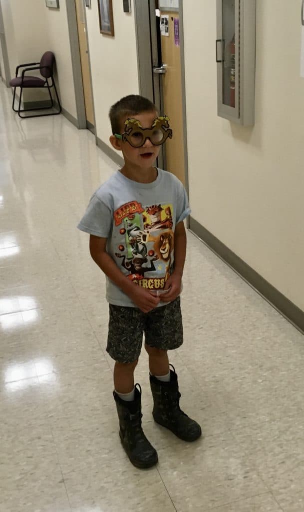 My son looks through special glasses to recite numbers and letters from an optical chart at the doctor's office. People who have ADHD need the best ADHD planner they can get. 