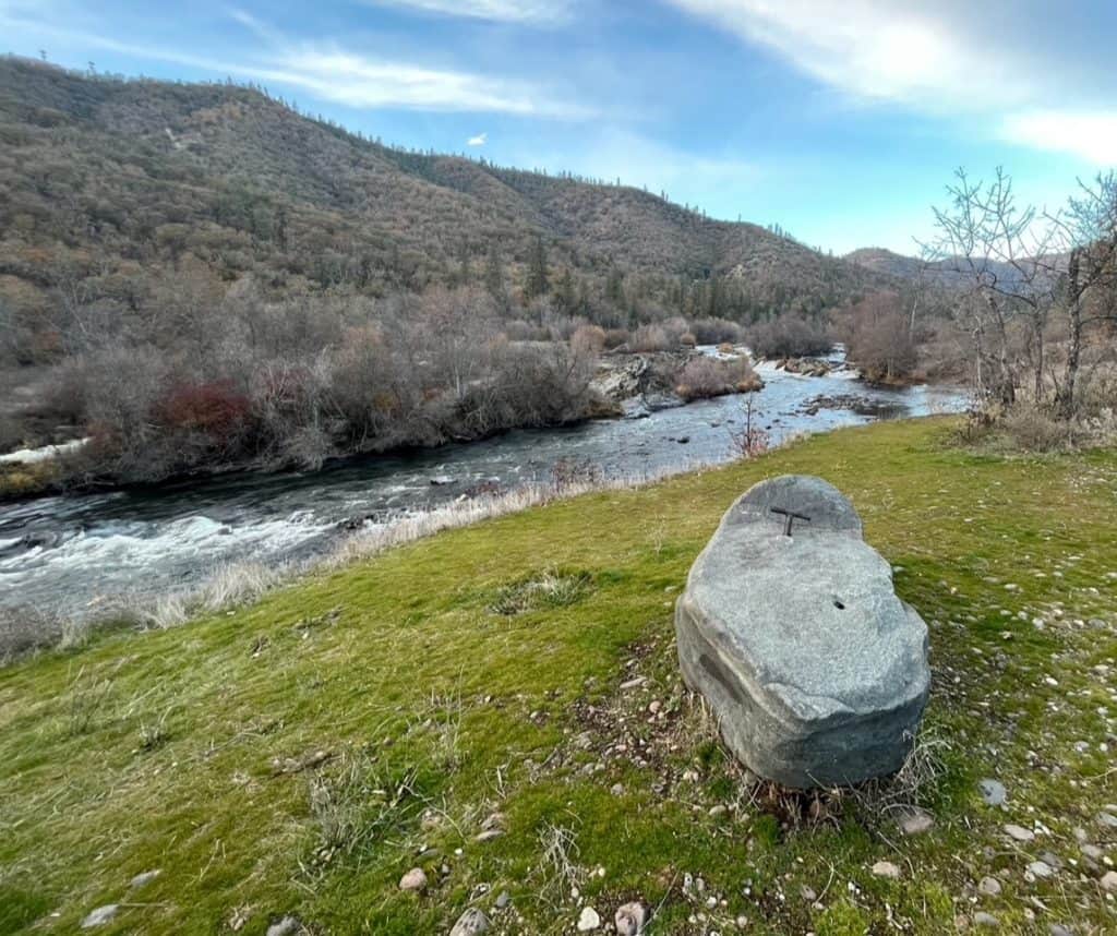 The Story Telling Stone sits beside the Rogue River in Southern Oregon.