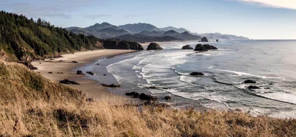Image shows the incredible view that can be found at Ecola State Park. Ecola State Park is a top stop for any trip to the Oregon Coast with kids.