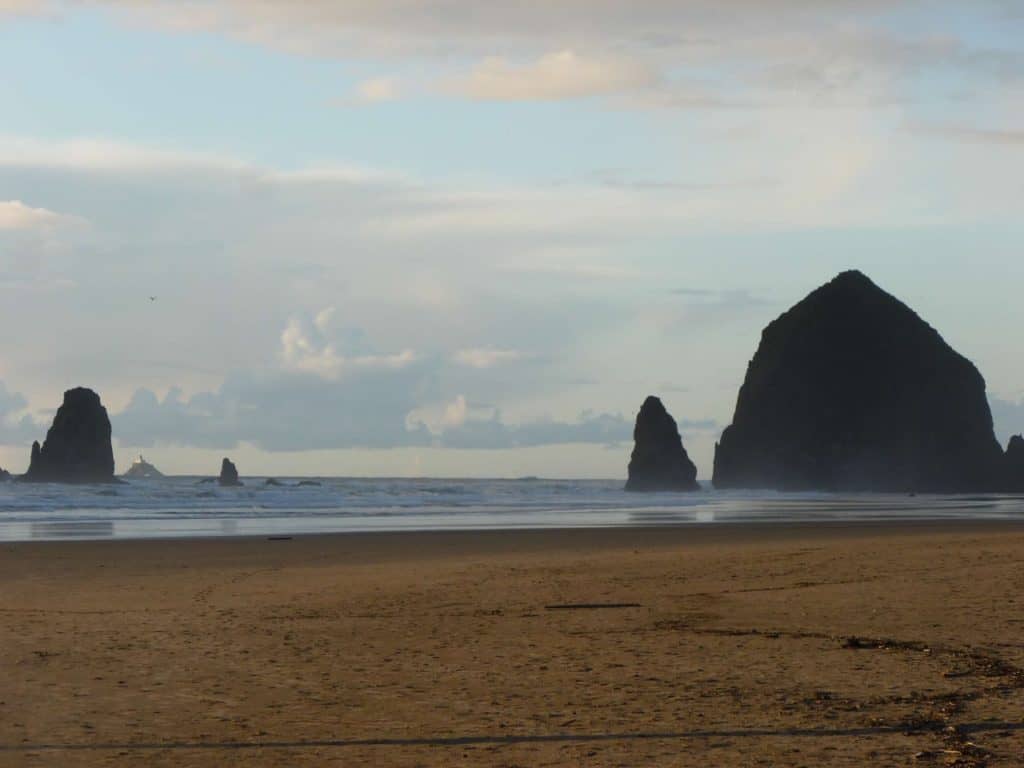 Image of Haystack Rock and neighboring sea stacks at Cannon Beach.