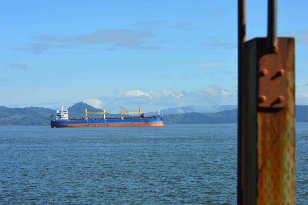An enormous tanker sits at anchor in the Columbia River near Astoria, Oregon. Astoria is one of the best cities to visit the Oregon Coast with kids.