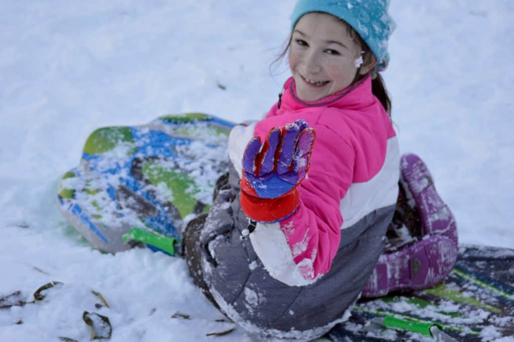 Girl on a sled. Winter Activities for Teens.