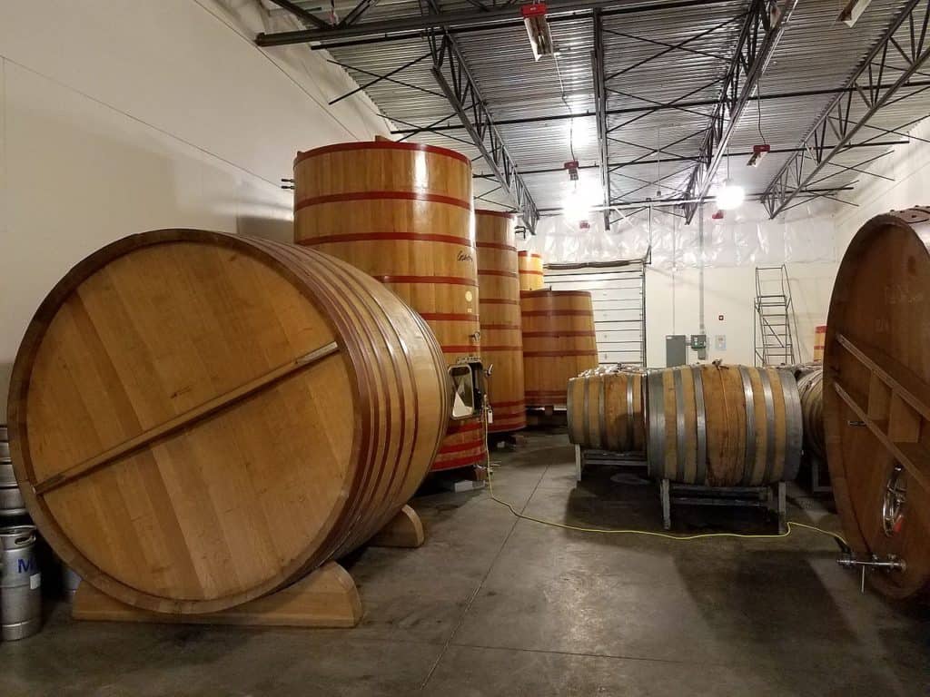 Enormous barrels sit and stand at De Garde Brewing in Tillamook Oregon. De Garde is one of several breweries Oregon Coast.