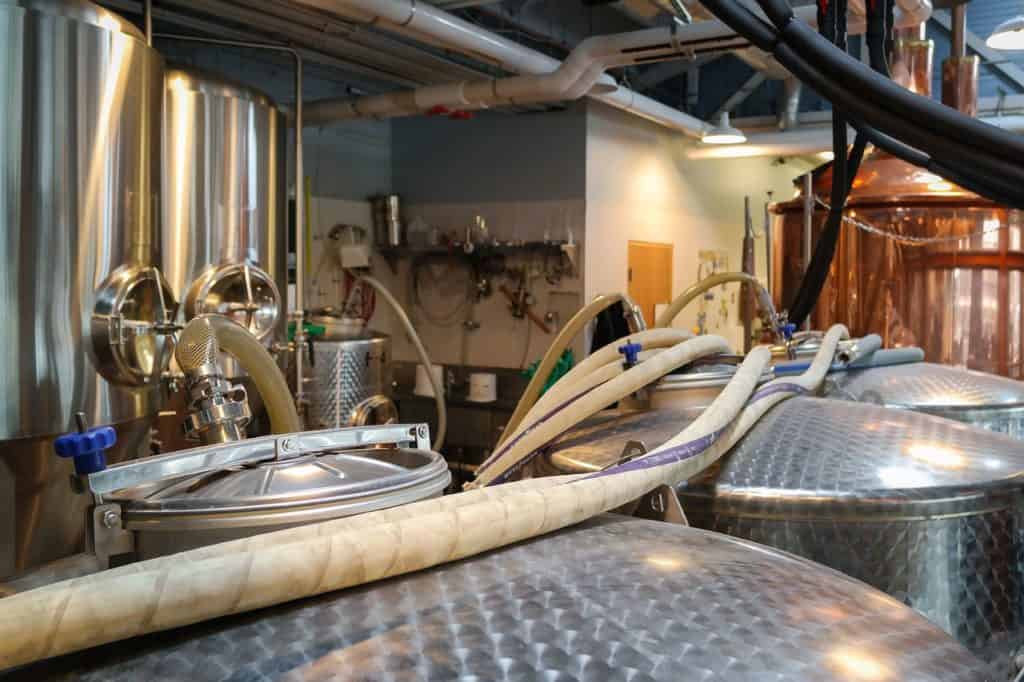 Fermentation tanks work away inside Falling Sky brewing.