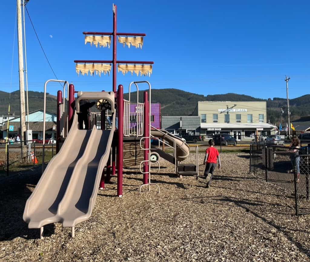 Our children play on a pirate-themed play structure at Rockaway Beach.