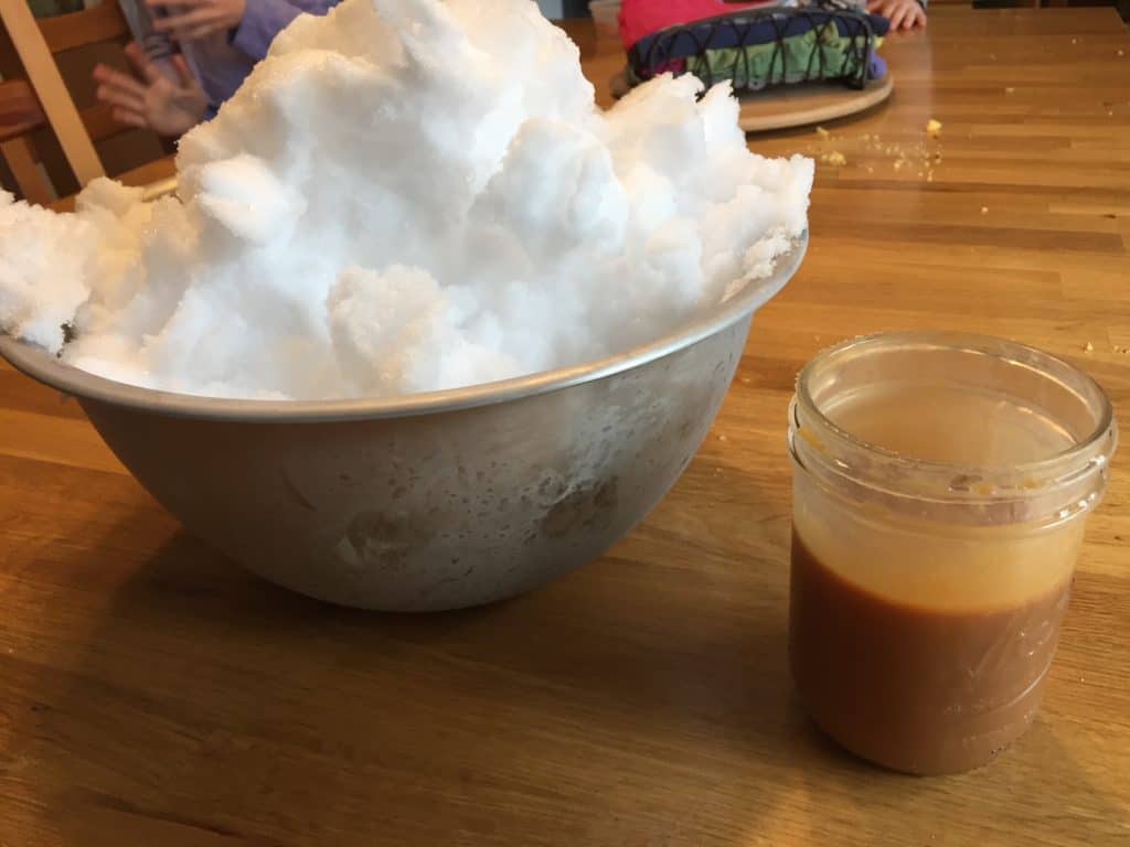Bowl of snow and jar of caramel sauce. Winter activities for teens.