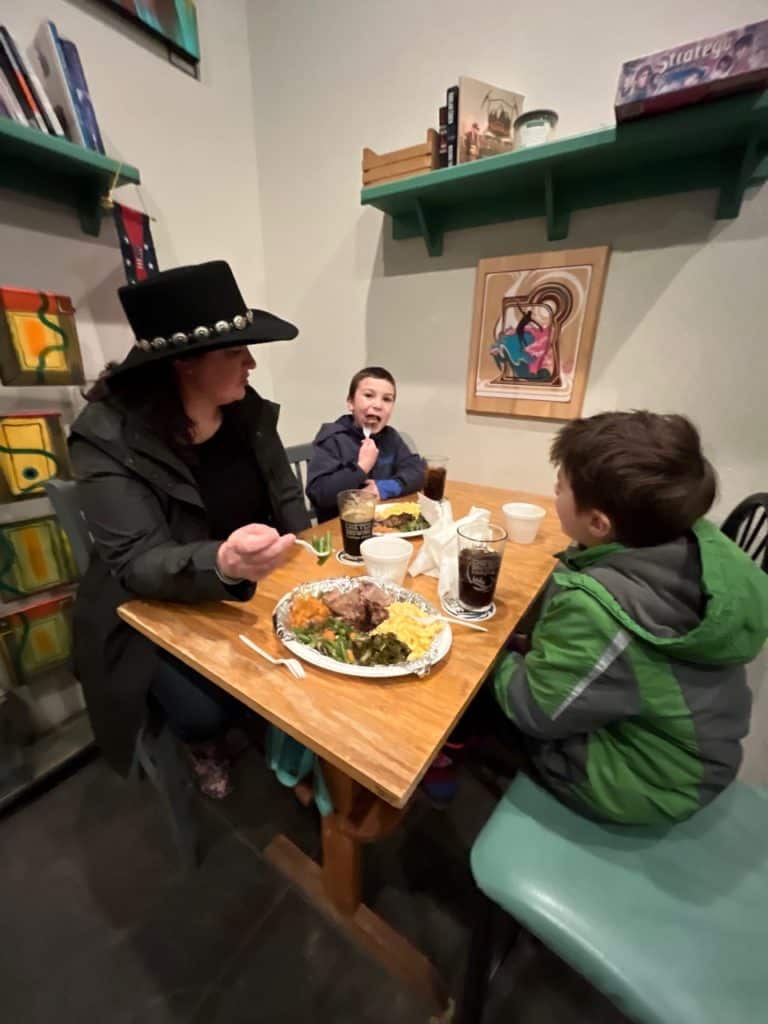 My wife and two of my boys dine at a table at Chetco Brewing Company. Chetco is one of many great craft breweries Oregon Coast.