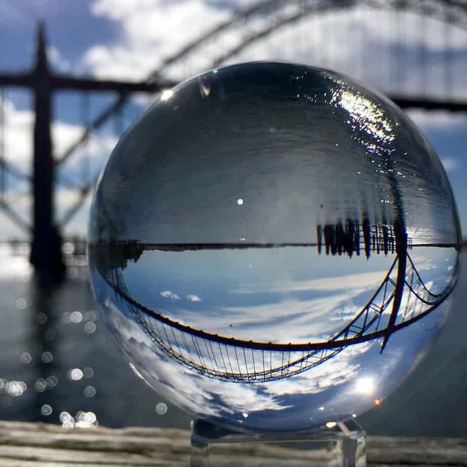 A glass sphere flips the image of the Yaquina Bay Bridge in Newport. 