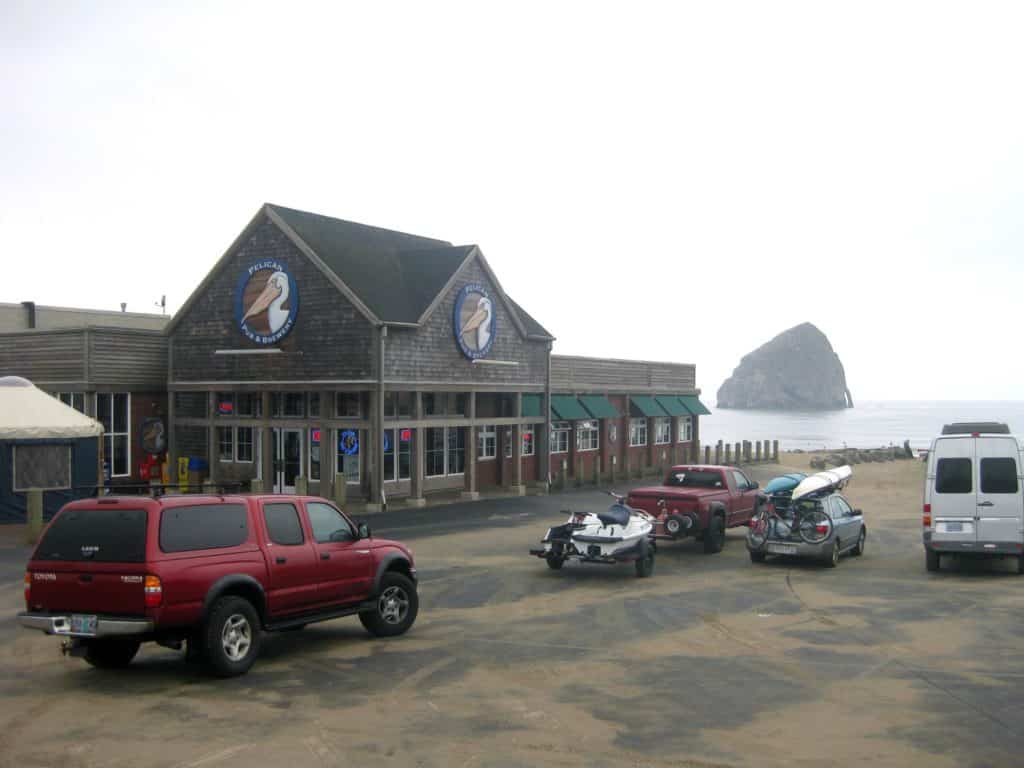 Haystack Rock stands just off the coast behind Pelican Brewing's flagship restaurant in Pacific City. Pelican Brewing is one of the great breweries Oregon Coast.