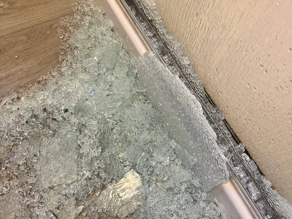 Shattered glass shower door. Symbolic of the shattered heart after parents' reactions to boundaries.