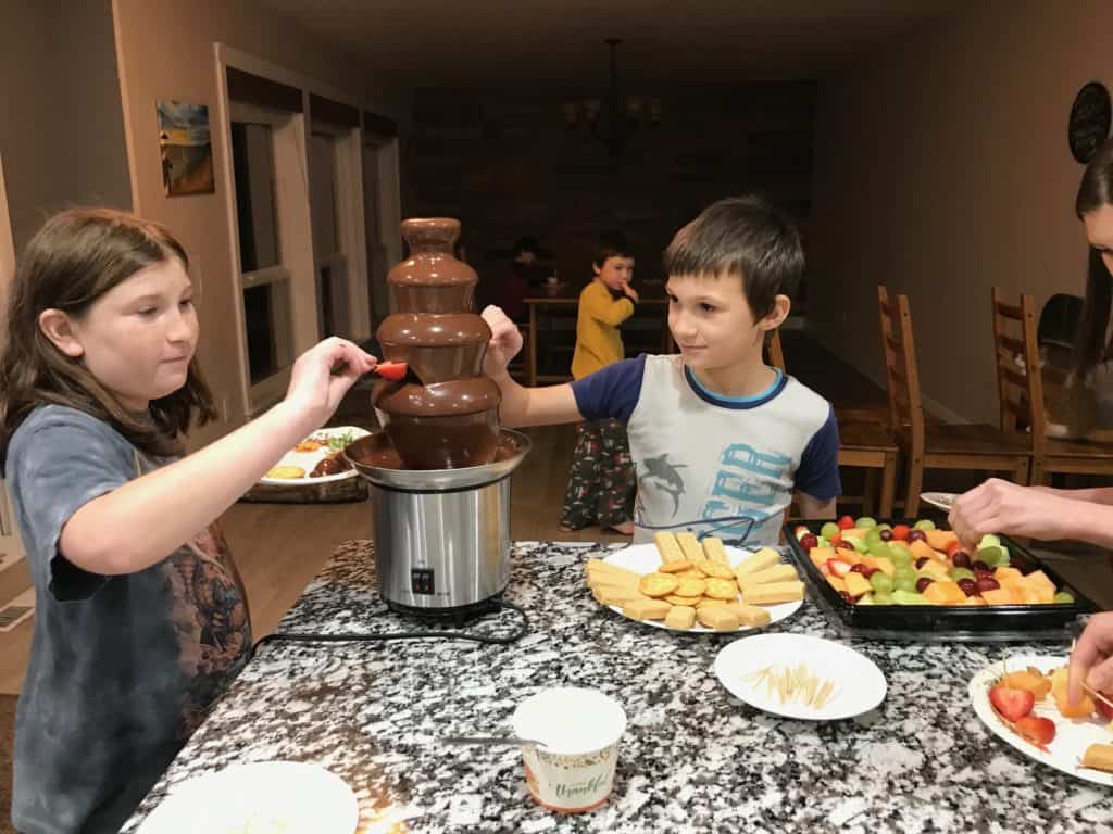 Kids enjoying chocolate fountain. protecting kids from toxic family