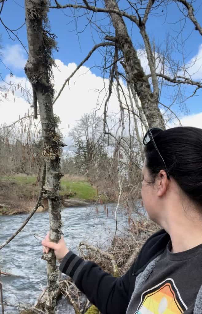 Woman staring at stream. Results of no contact with toxic family.