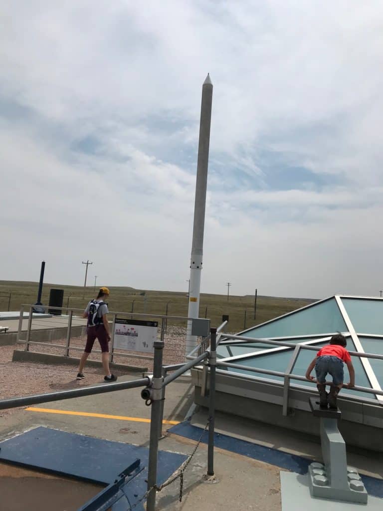 Children study the parts of a missile silo at Minuteman Missile National Historic Site.